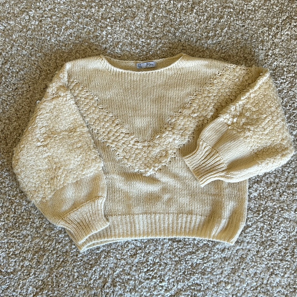 Retro vibe in this never worn cream knit with extra knitted details!